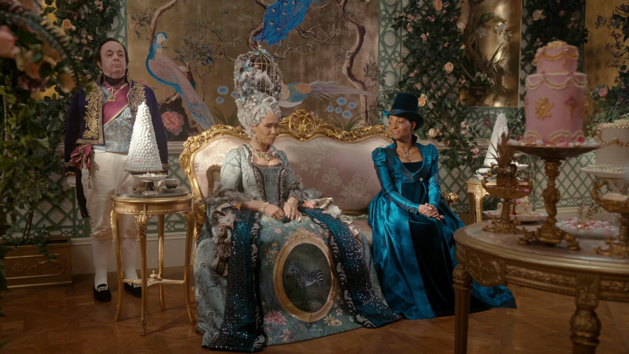 Hugh Sachs as Brimsley, Golda Rosheuvel as Queen Charlotte, Adjoa Andoh as Lady Danbury in 'Bridgerton' Season 4. 