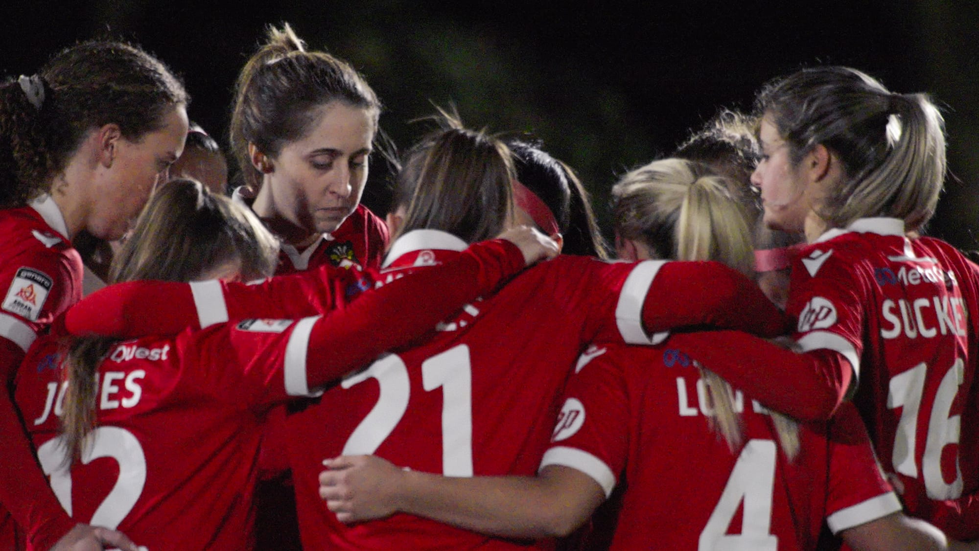 The Women's Team huddles in 'Welcome to Wrexham' Season 4