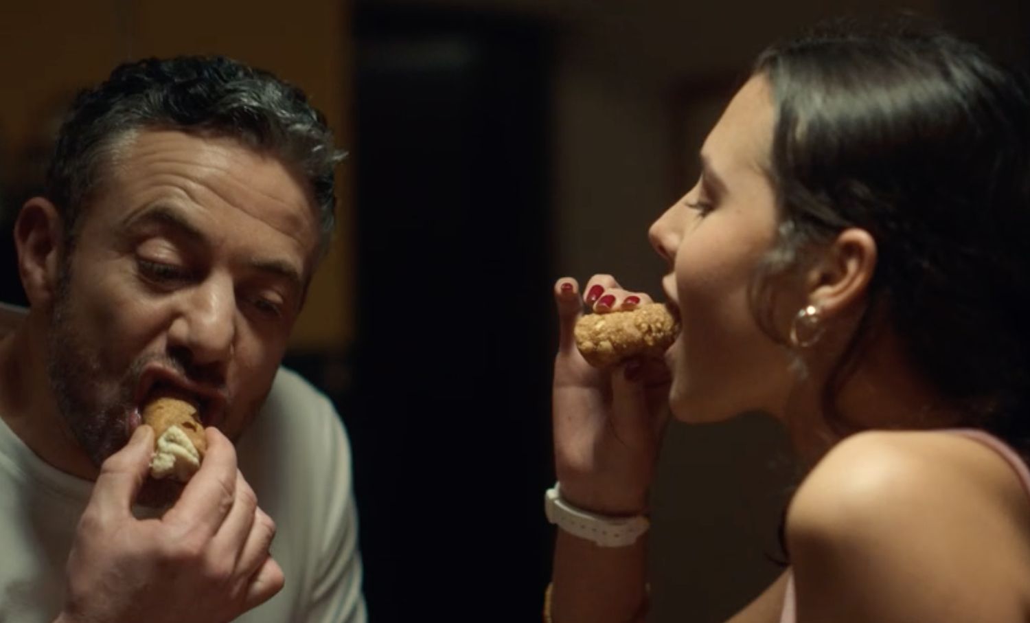 Joe (Warren Brown) and Angelica (Beau Gadsdon) enjoy their cannoli.