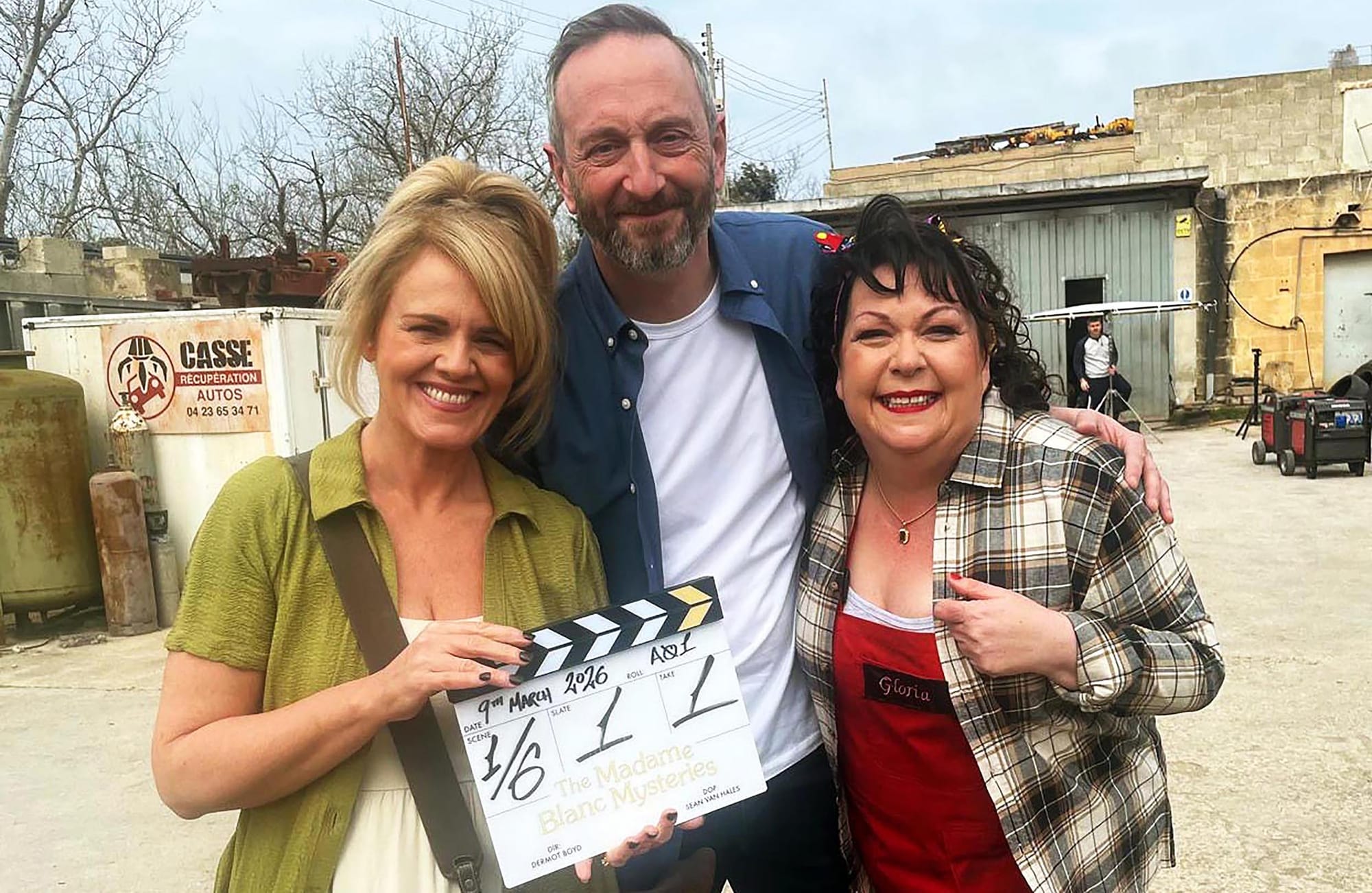Sally Lindsay, Steve Edge, and Sue Vincent hold the clapper from 'The Madame Blanc Mysteries' Season 5 start of production