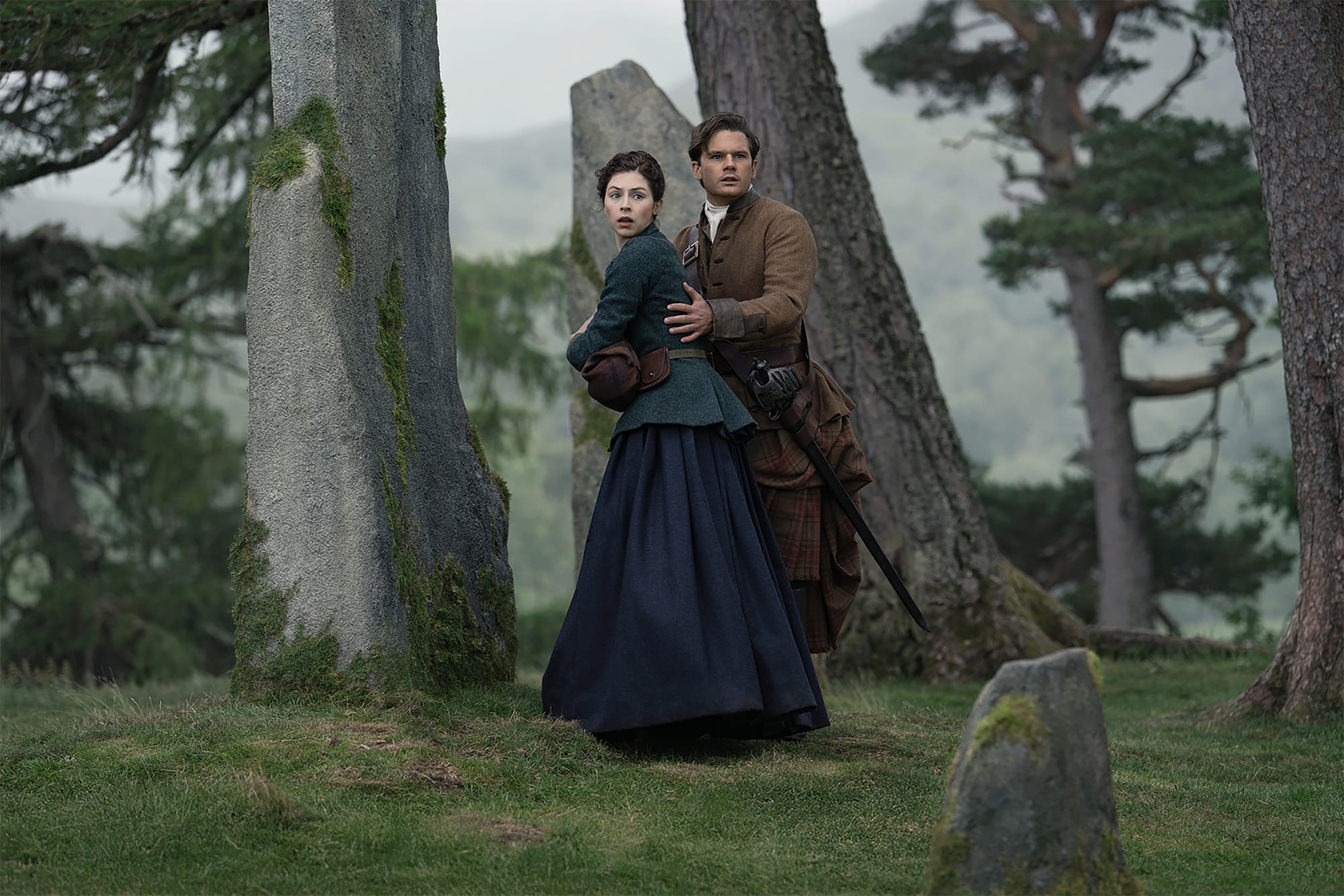 Hermione Corfield and Jeremy Irvine in 'Outlander: Blood of my Blood' Season 2