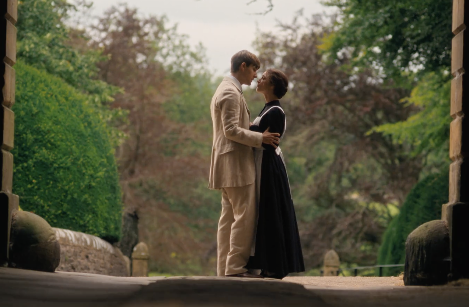 Edwin (Ewan Horrock) and Emma (Jessica Reynolds) embrace outside the stables