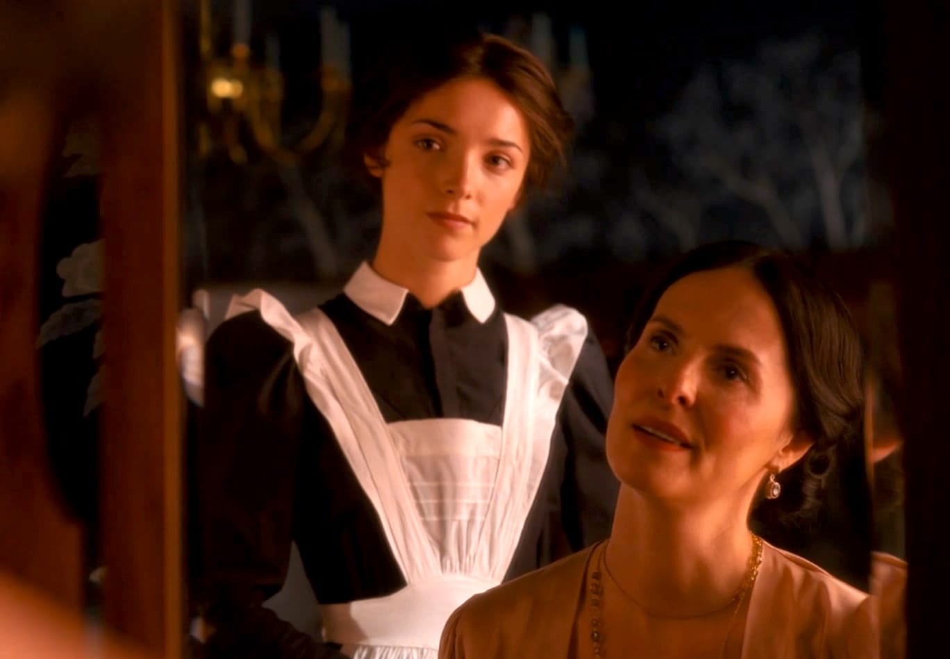 Emma (Jessica Reynolds) and Adele (Leanne Best) reflected in a mirror.