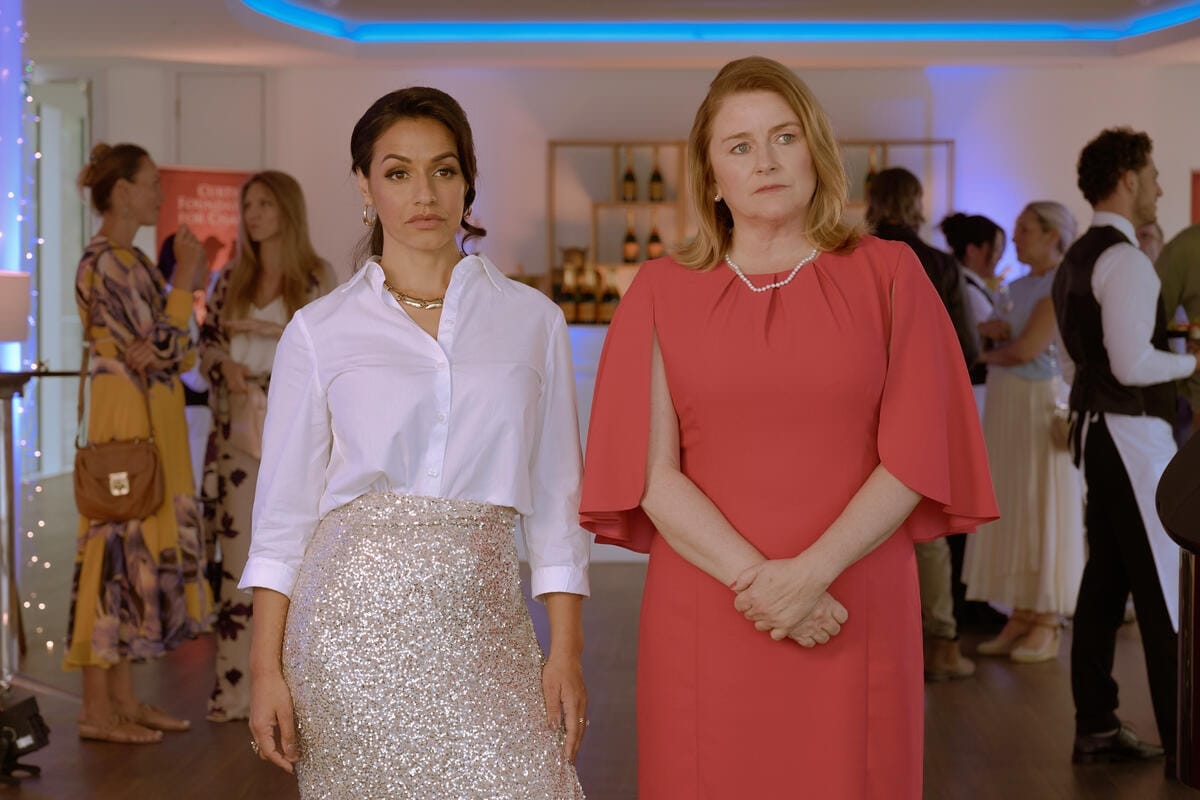 Fashion mogul Claire Curtis (Saira Jackson) and Joanna Picard (Rosie Cavaliero), owner of the ECHOS agency at the silent auction