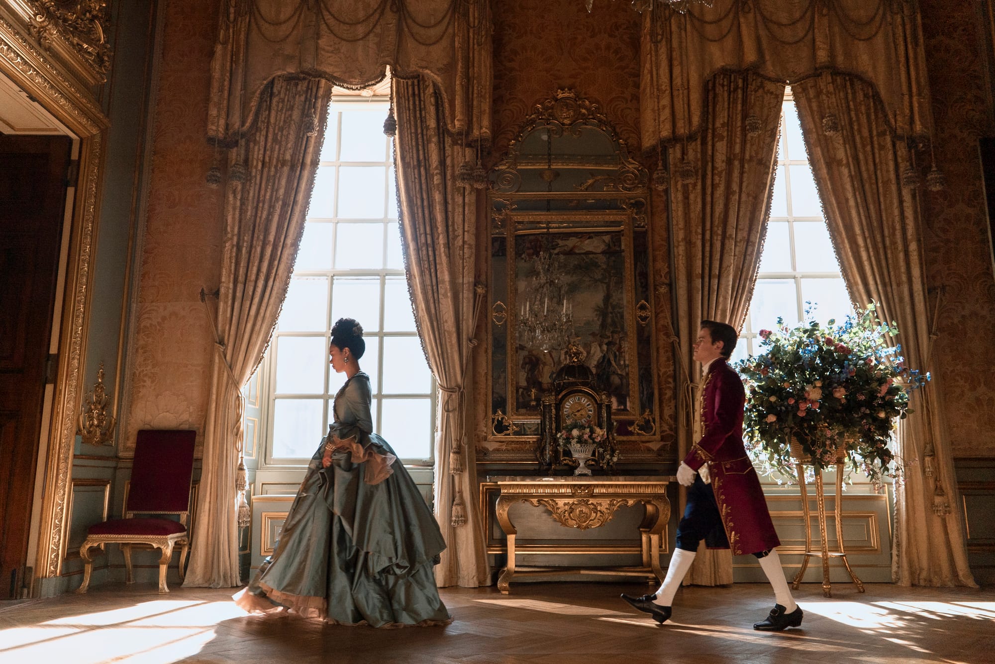 Corey Mylchreest as Young King George, India Amarteifio as Young Queen Charlotte in Queen Charlotte: A Bridgerton Story.