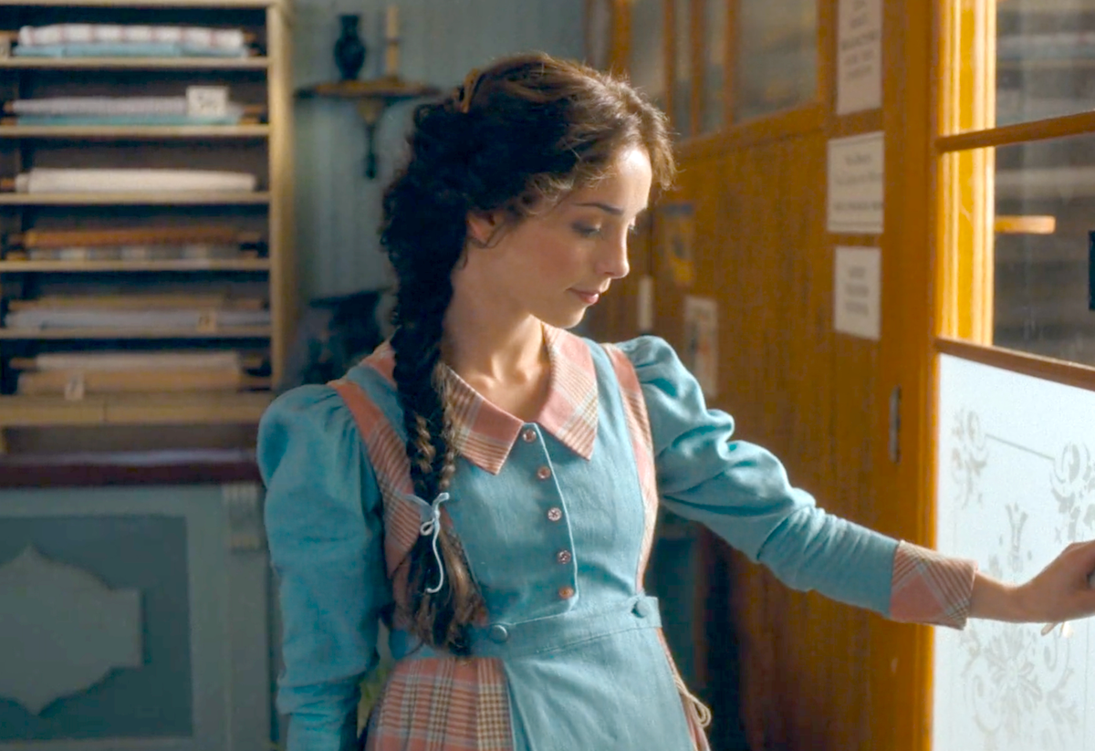 Emma (Jessica Reynolds) at the door of Joe Lowther's shop