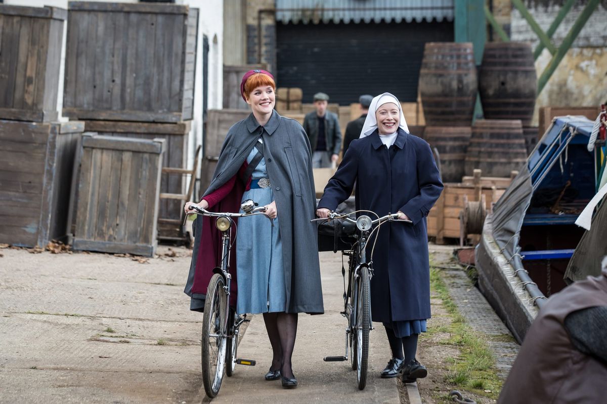 Patsy Mount (Emerald Fennell) and Sister Winifred (Victoria Yeates) with bikes.