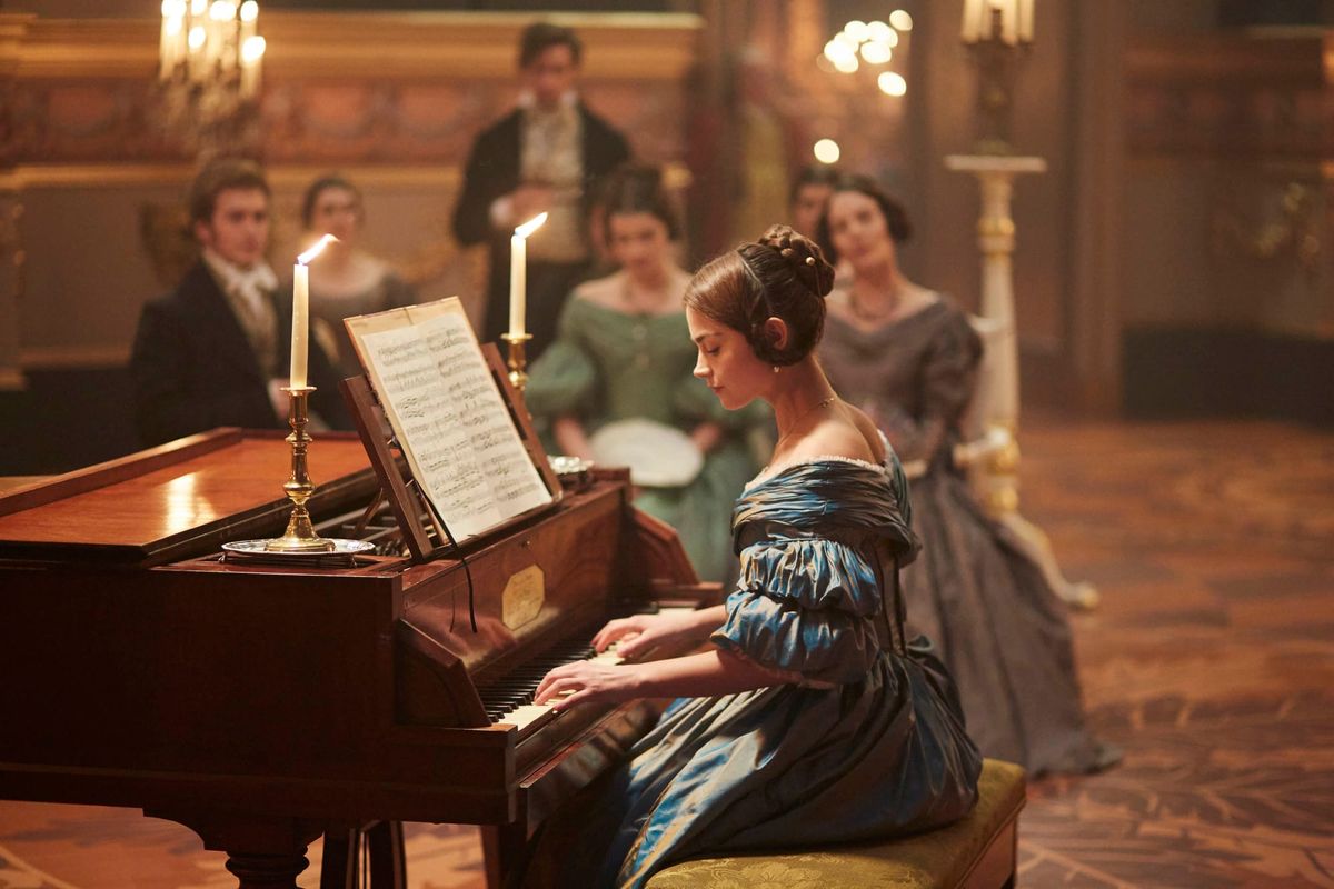 Victoria (Joanna Coleman) playing piano.