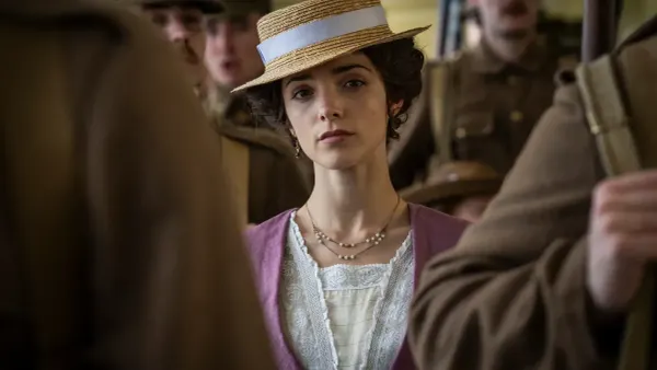 Emma Harte (Jessica Reynolds) at the railway station where soldiers, including Joe and Mac, are boarding a train to the war.
