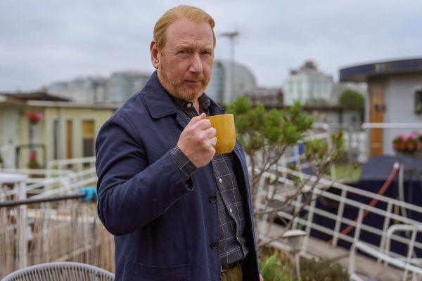 DI Max Arnold (Adrian Scarborough) aboard his houseboat enjoys a cup of coffee