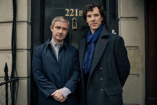 Benedict Cumberbatch (Sherlock) and Martin Freeman (Watson) outside their front door.