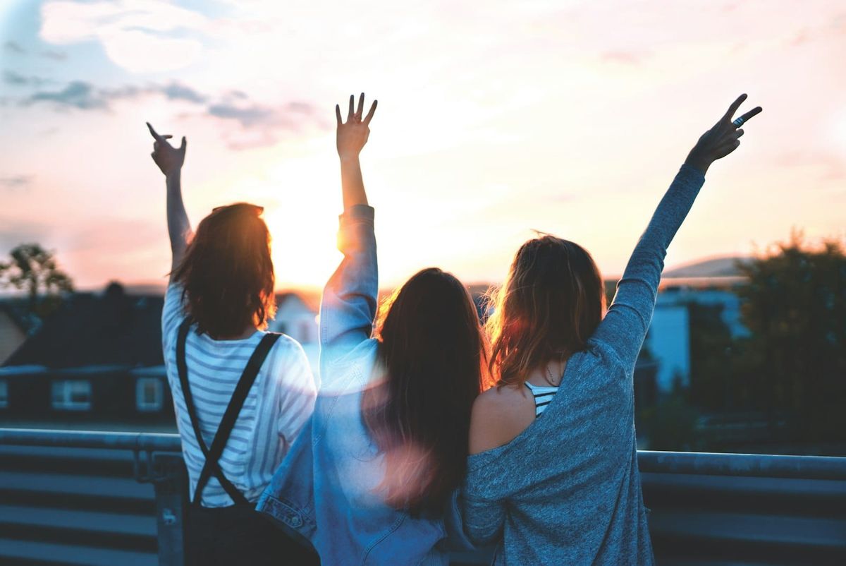 Friends laughing outdoors