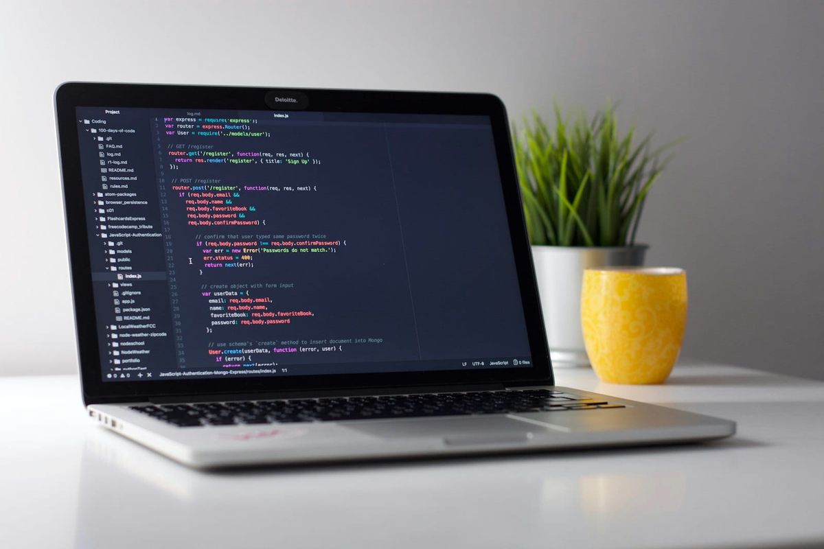MacBook with code editor