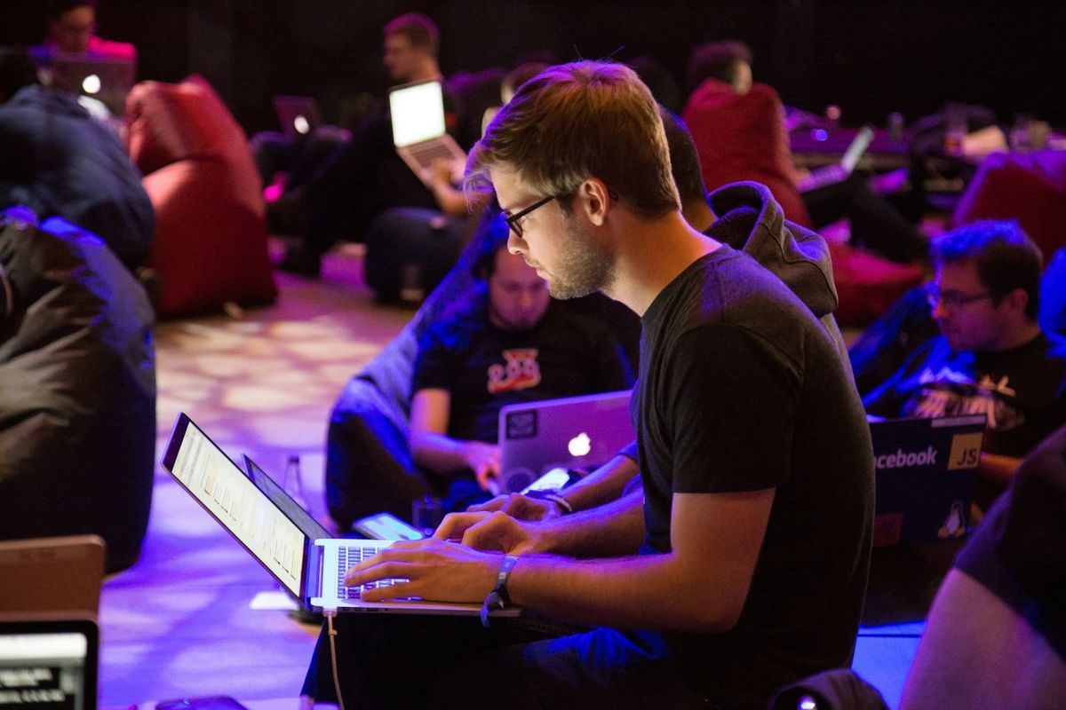 Developers pair-programming at desks
