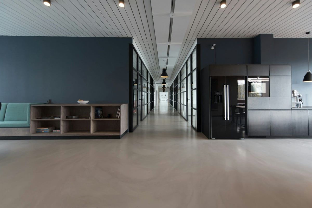 Bright modern open-plan office with glass partitions