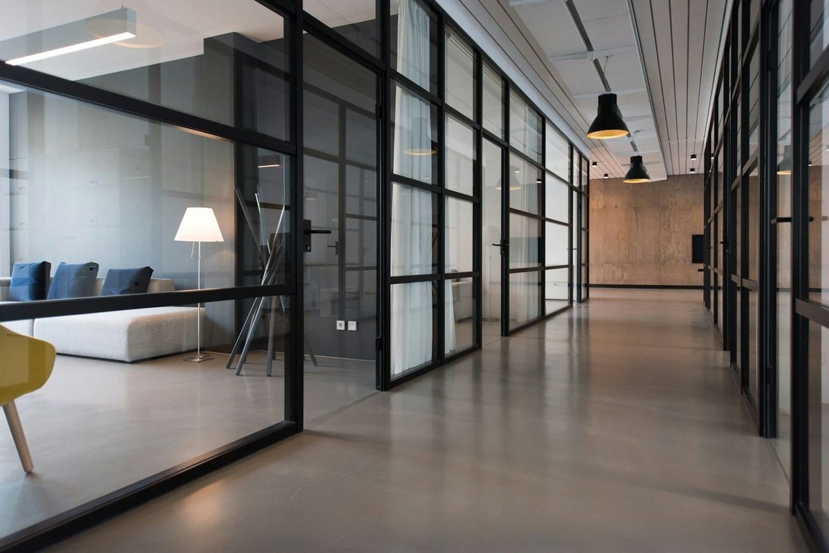 Glass-walled meeting rooms in a contemporary office
