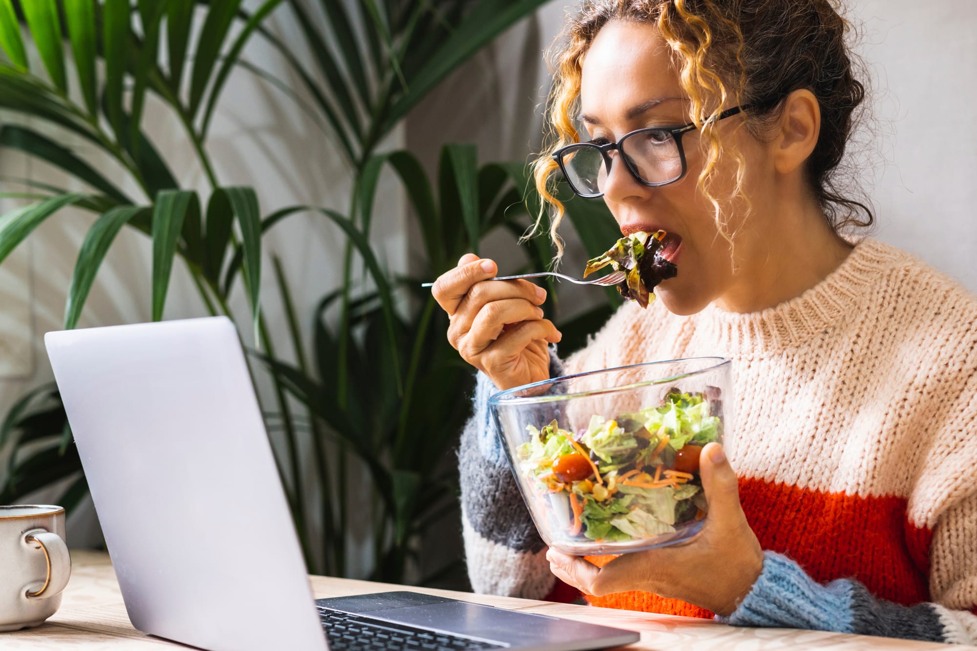 A person taking an online course  during her lunch break, exemplifying a small, consistent daily effort.