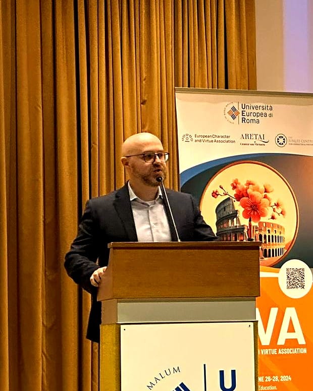 Shane McLoughlin at the lectern in Rome