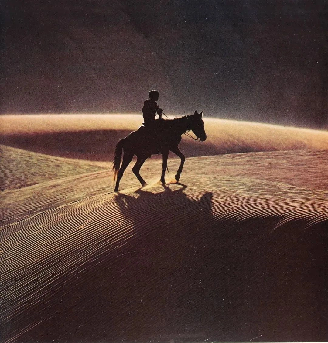 Silhouette of a rider on the dunes of the Mojave Desert, photo by Terry Eiler, 1971