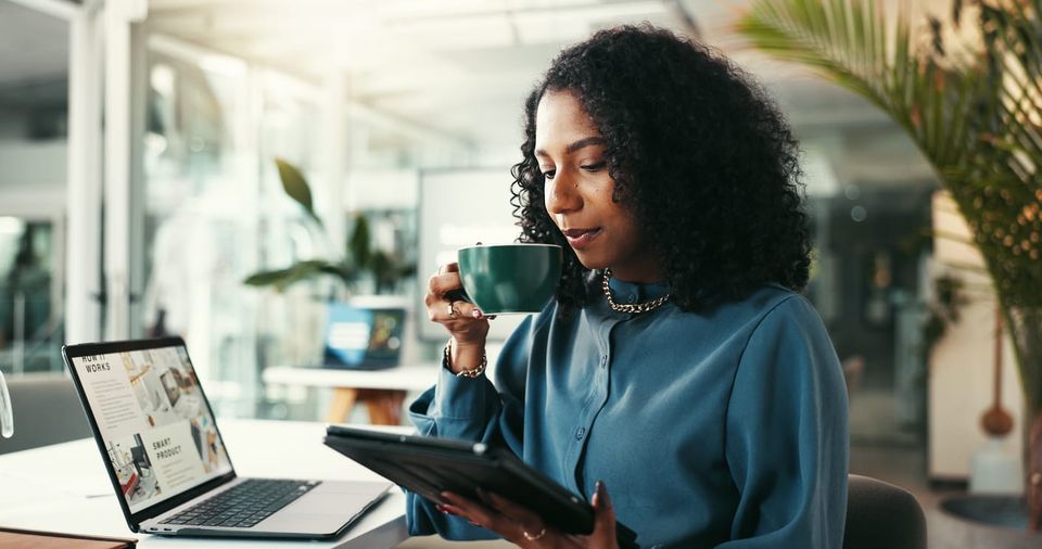 iStock: Jacob Wackerhausen | Morning, coffee and woman with tablet, reading online.
