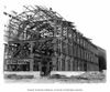 Image of steel frame building, black and white.