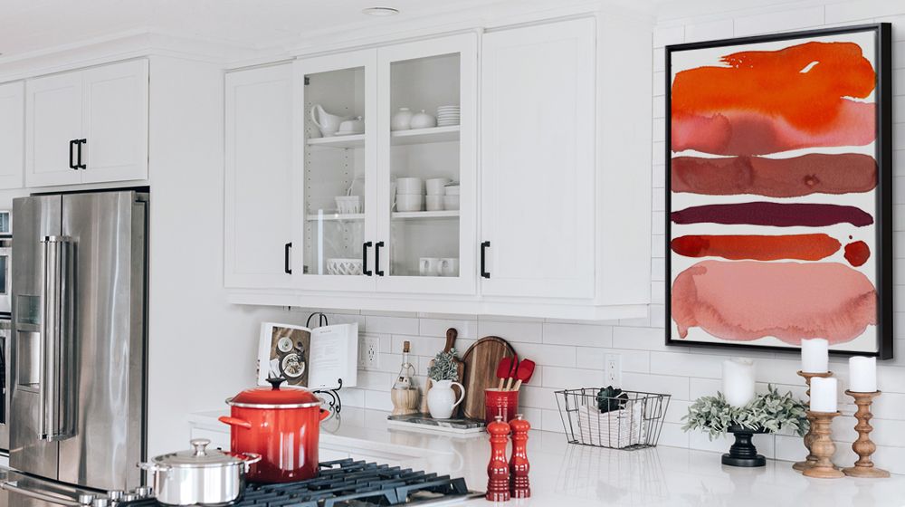 Red abstract watercolor framed canvas print in a contemporary kitchen.