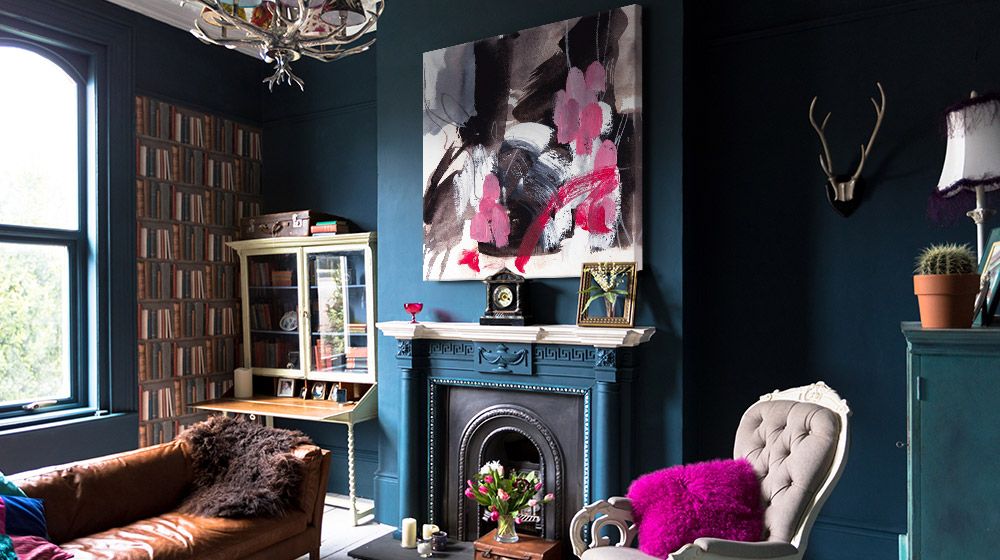 Abstract canvas print in over a fireplace in a luxurious modern living space.