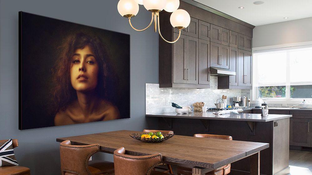 Large photographic portrait of a woman canvas print in modern Dining Room/Kitchen interior.
