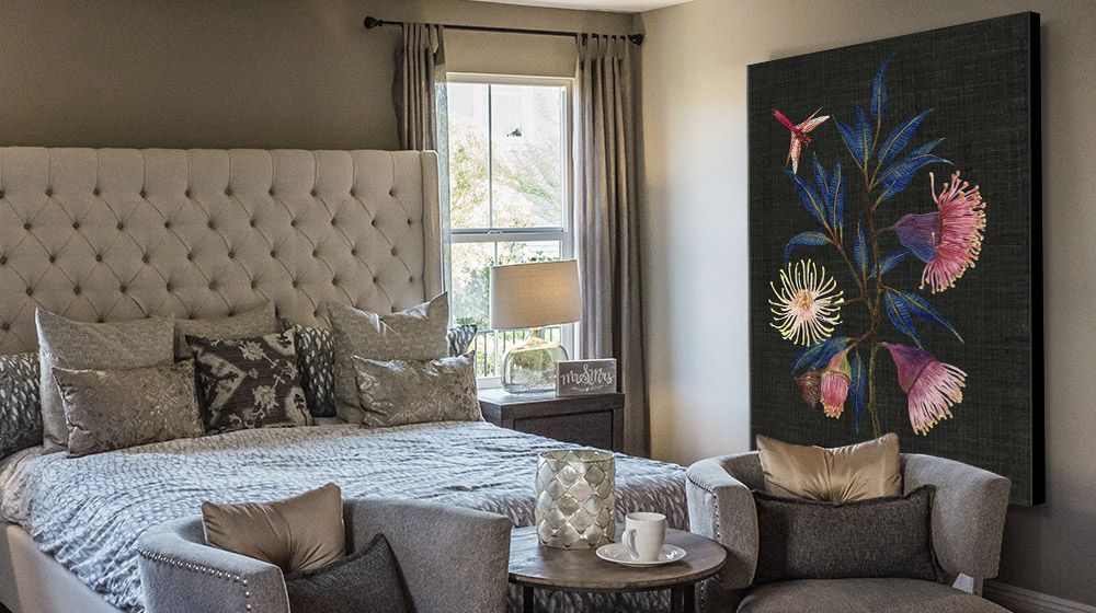 Large floral canvas art print in a stylish neutral bedroom interior