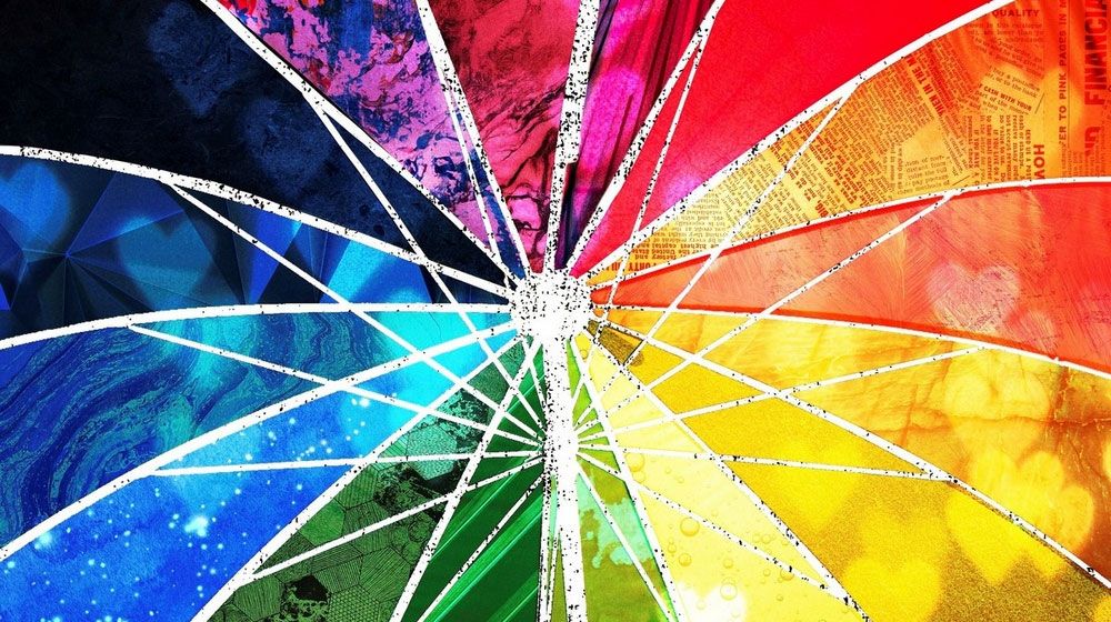 Detailed close up image of rainbow collage umbrella artwork.