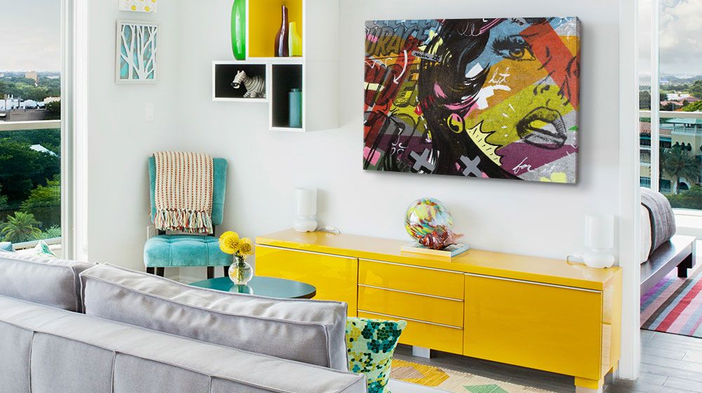 Colorful pop art comic inspired canvas print in a vibrant living room with contemporary furniture.