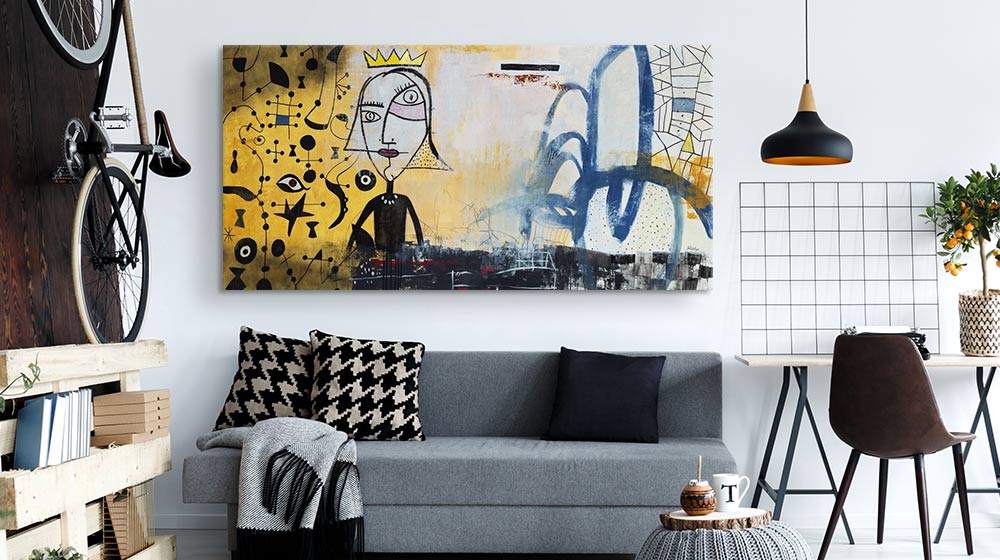 Oversized modern urban canvas print over a couch in a contemporary living room