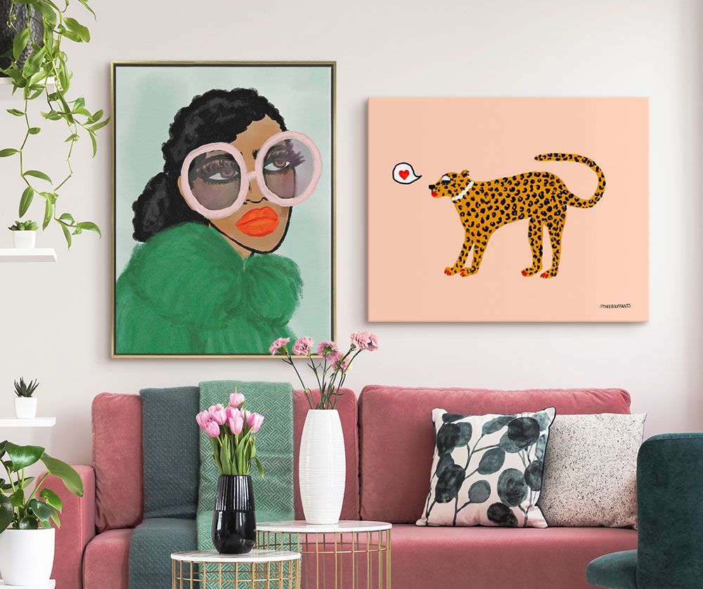 contemporary living interior with bright modern art hung over a pink couch