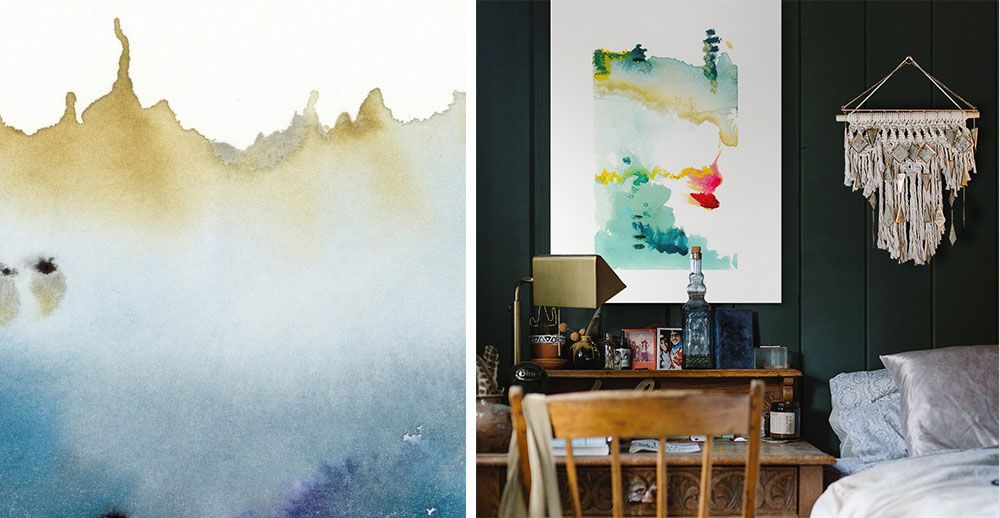 Watercolor abstract canvas print on the wall of a dark bedroom interior.