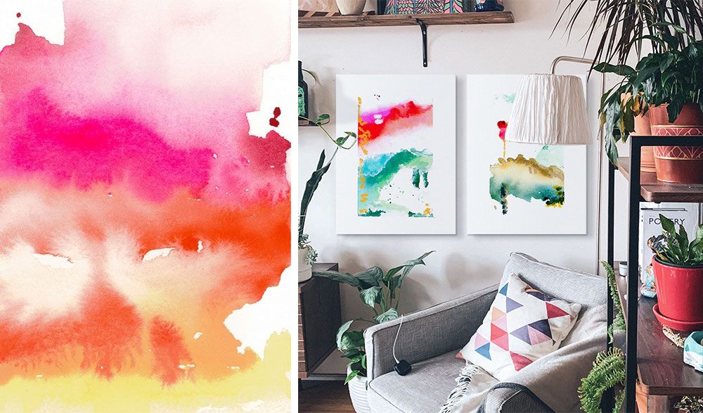 A Room interior of a living room with two canvas prints of watercolor abstract work hanging on wall.