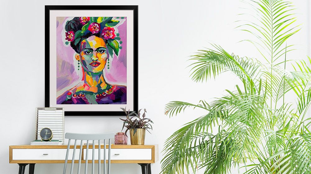 Motivational feminine framed print in a bohemian home office interior