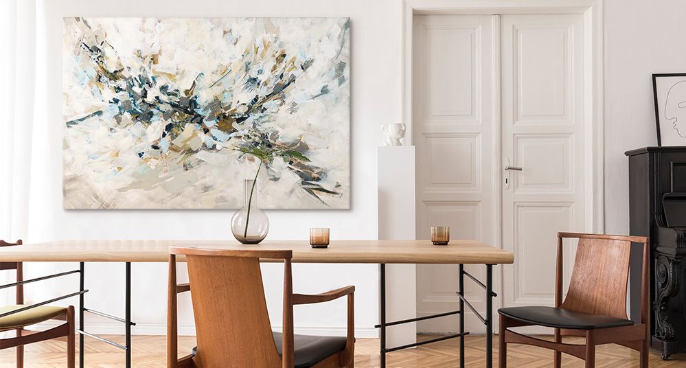 A large neutral abstract canvas print in a modern dining room. 