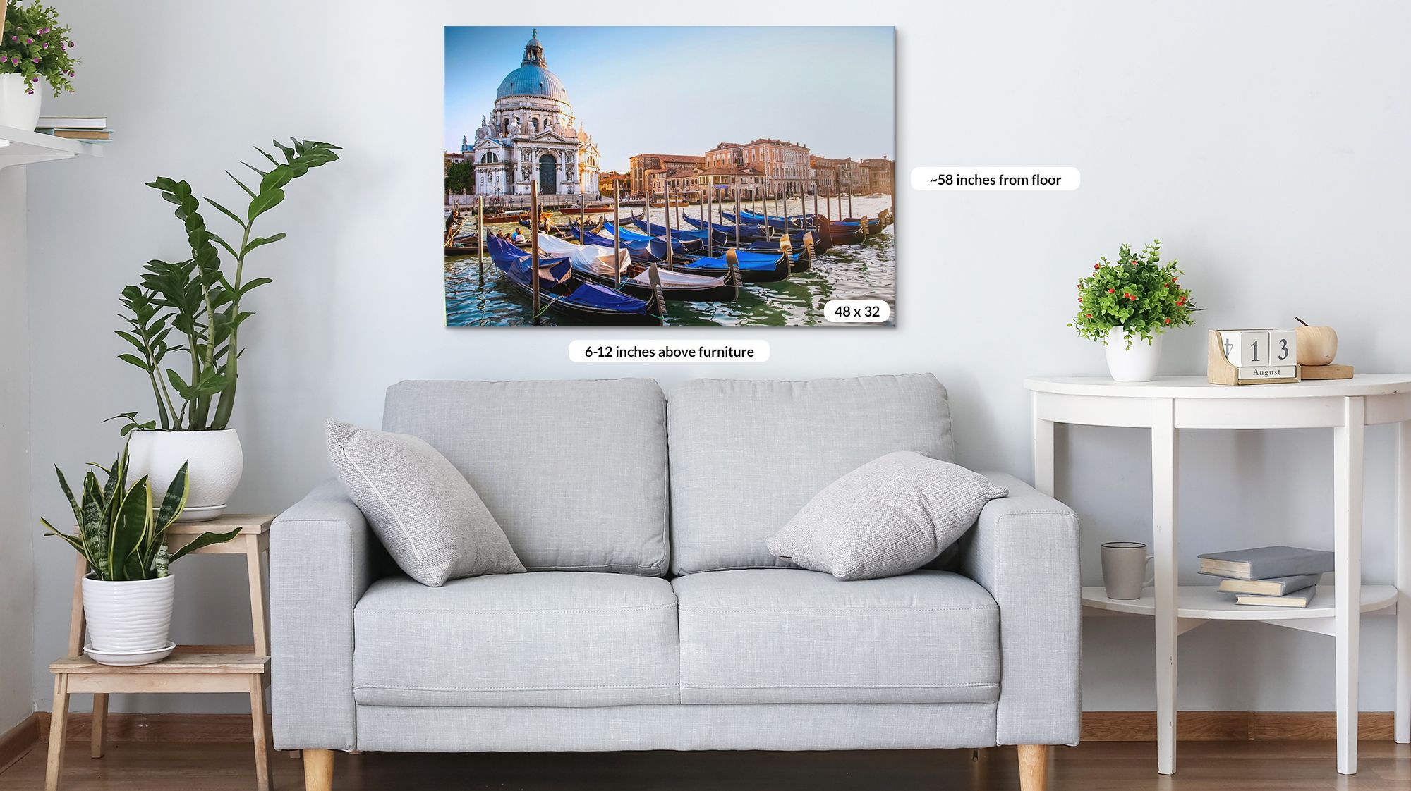 Contemporary photography art print over a couch in a living room with hanging tips.