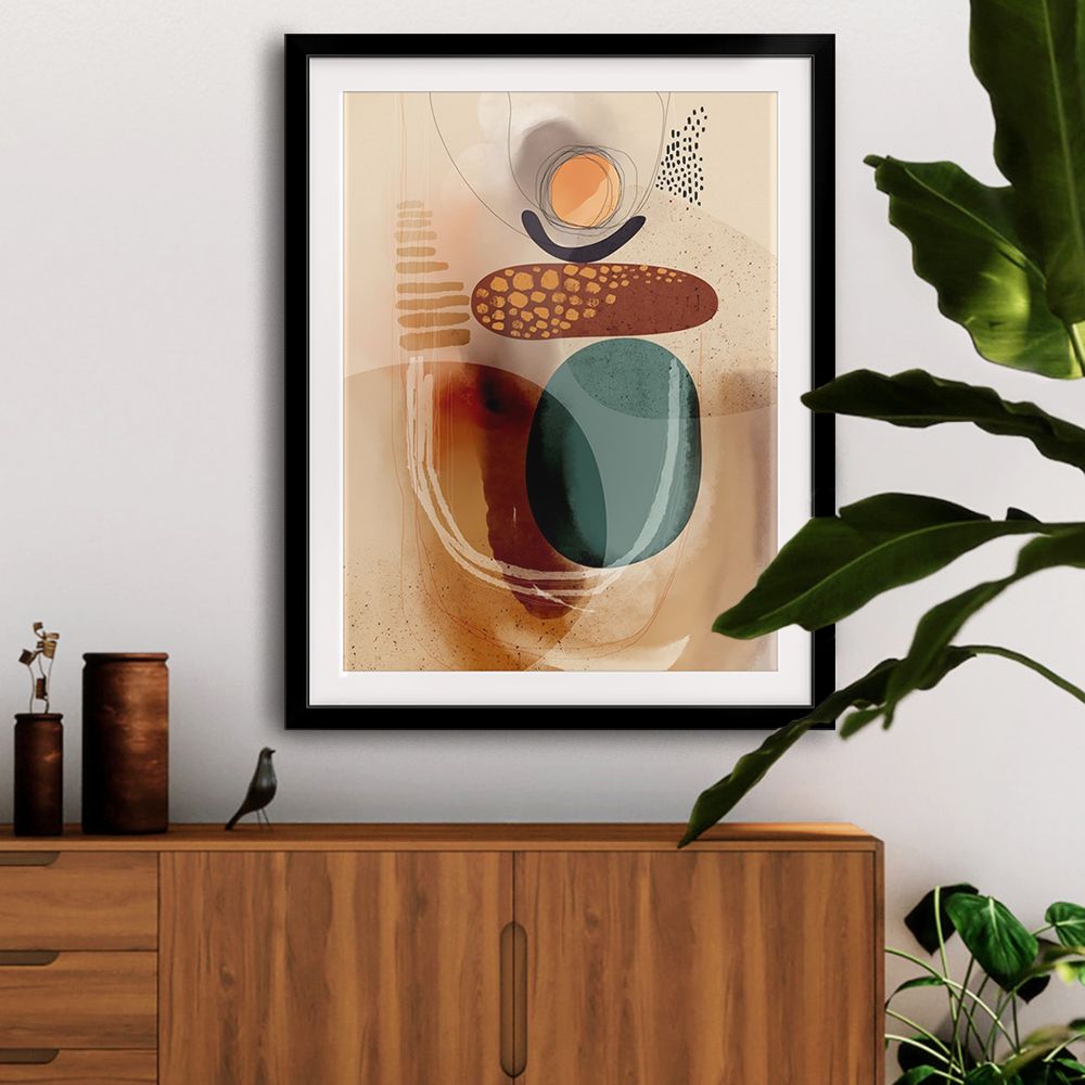 Geometric wall art with blue, red, and neutral-tones in a black frame over a brown dresser.