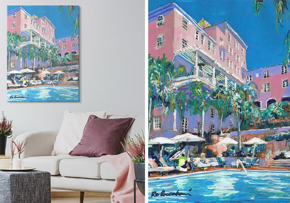 Side by side images of wall art featuring a pink hotel with a pool over a couch and the original painting.