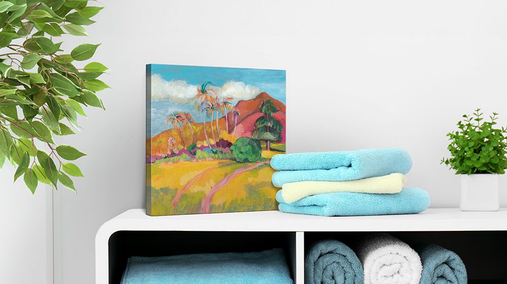 Ode to Gauguin I by Jennifer Goldberger canvas art pictured standing on top of a bathroom cabinet