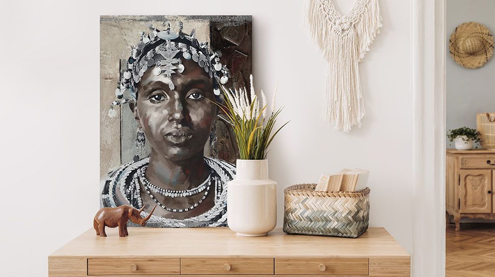 Painted Woman I Wall Art by Tia Sanders sitting on top of a desk