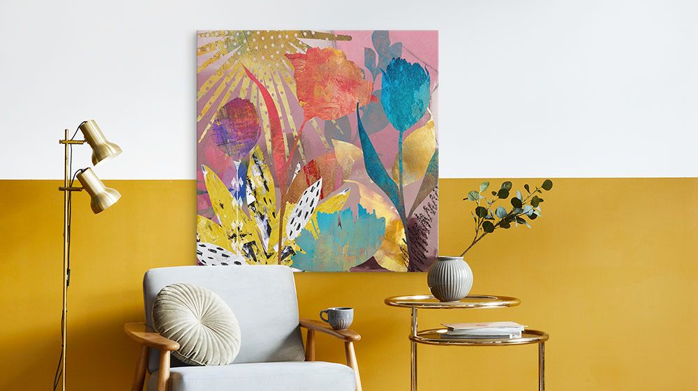 Sunshine And Love Wall Art by Nikki Chu hung on a wall and paired with some modern furniture and accessories