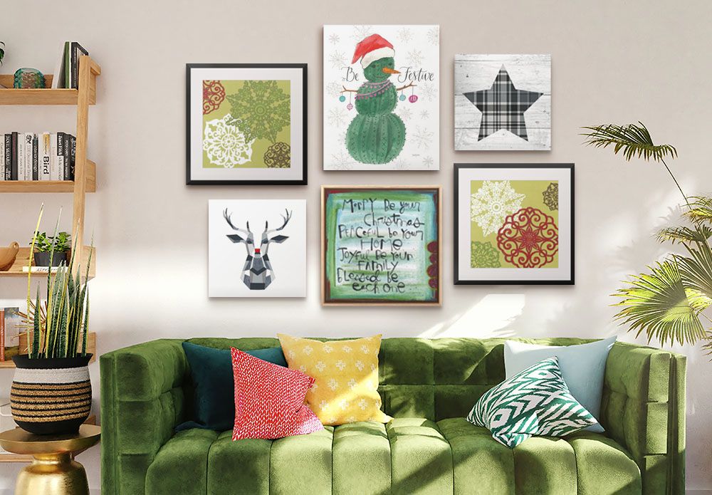 Assorted Christmas Canvas Prints hung above a sofa