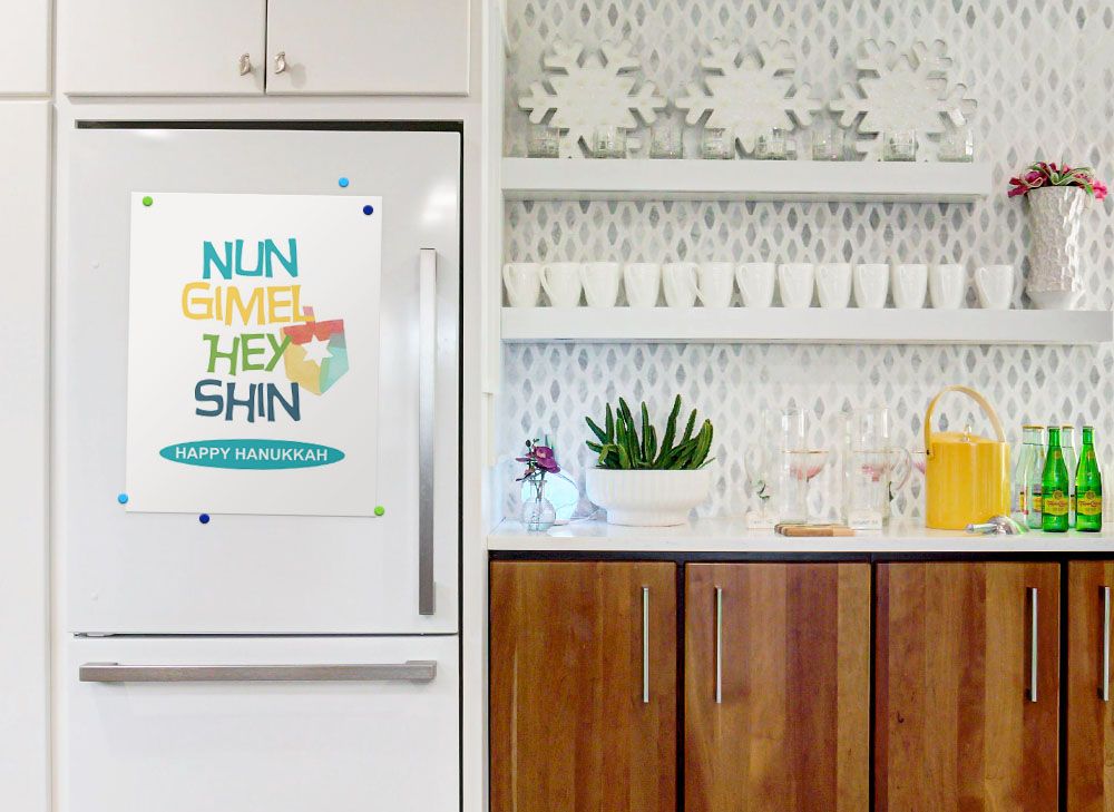 Dreidel Words II Wall Art by Linda Woods printed on Poster Paper, displayed on a refrigerator door