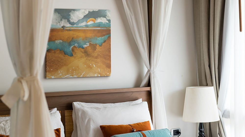 Desert River&nbsp;Wall Art by SpaceFrog Designs printed on canvas and hung over a headboard