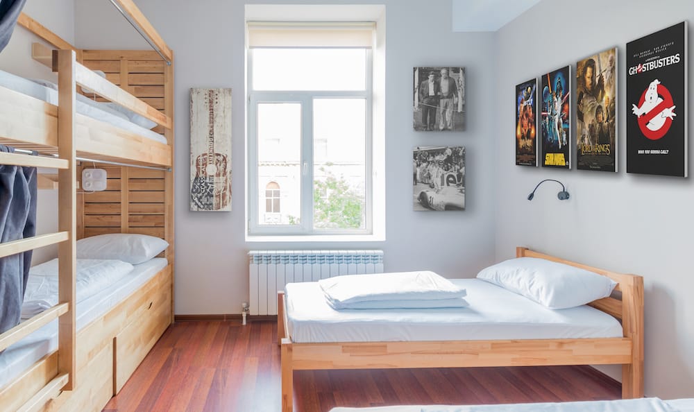 Dorm room decorated with wall art of movie posters