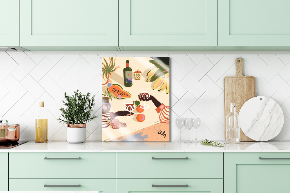 Colorful metal print art displayed on top of the counter of a modern minimalistic kitchen.