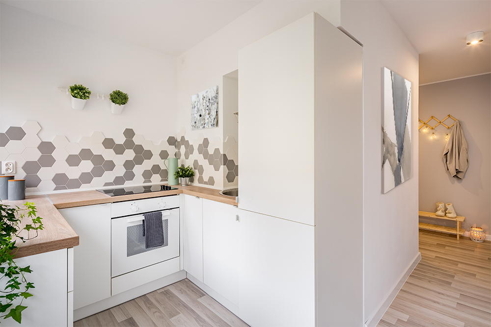 Small, modern kitchen with Scandinavian design and geometric accents.