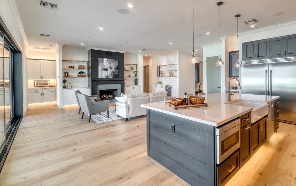 Open kitchen and living area featuring a large abstract wall art.
